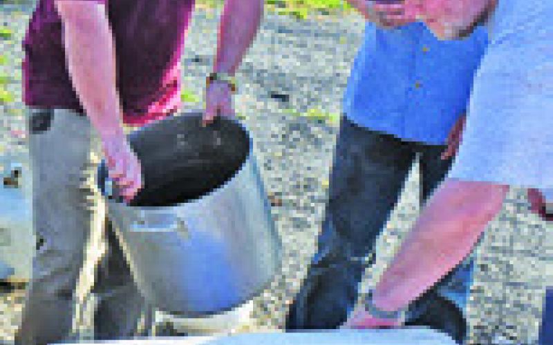 THE COOKERS WORK at the Cops 4 Kids Shrimp Boil Fundraiser on Saturday in Snook. -- Tribune photo by Roy Sanders