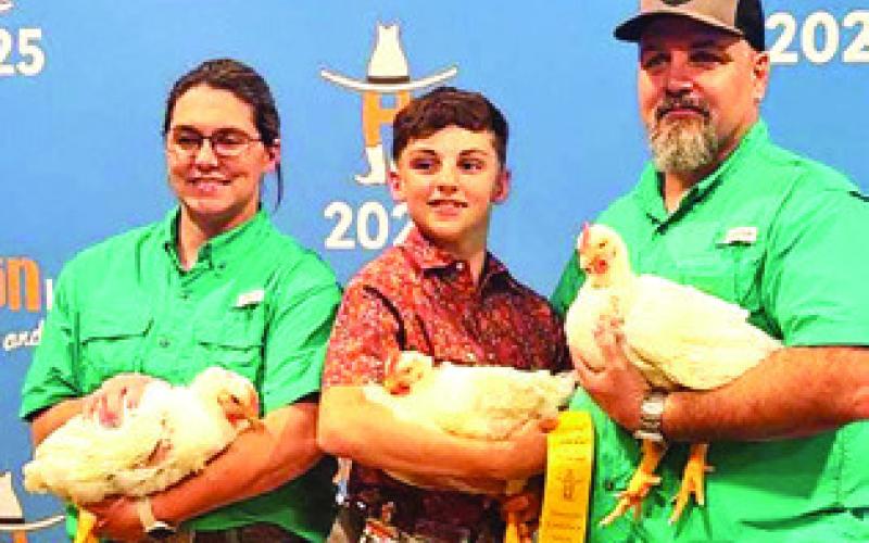 JACE THIGPEN, SNOOK FFA MEMBER, was 44th place with his cockerels, making the auction, at the Houston Livestock Show and Rodeo. Photo courtesy of Snook FFA