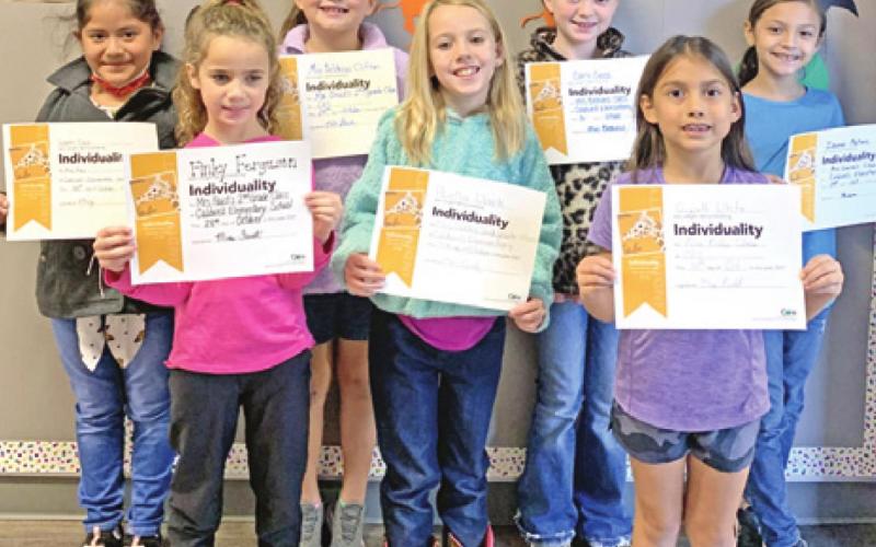 SEVEN SECOND-GRADE students at Caldwell Elementary School were recognized with Person of Value for Individuality certificates. Pictured from the left are: Lizeth Diaz, Finley Ferguson, Mia Balderas Clifton, Abella Clark, Carli Cross, Gwynth White, and Izamar Martinez.