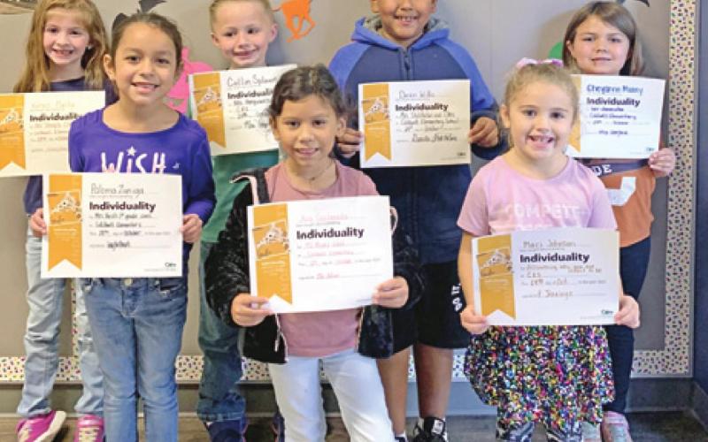 SEVEN FIRST-GRADE students at Caldwell Elementary School were recognized with Person of Value for Individuality certificates. Pictured from the left are: Kyren Plachy, Paloma Zuniga, Collins Splawn, Ava Castaneda, Deion Willis, Maci Johnson, and Cheyanne Muzny.
