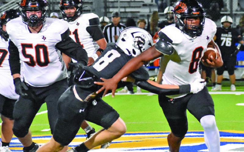 JA’KEITH DANIELS CARRIES the ball for Somerville against Junction in the bi-district playoff last Friday.