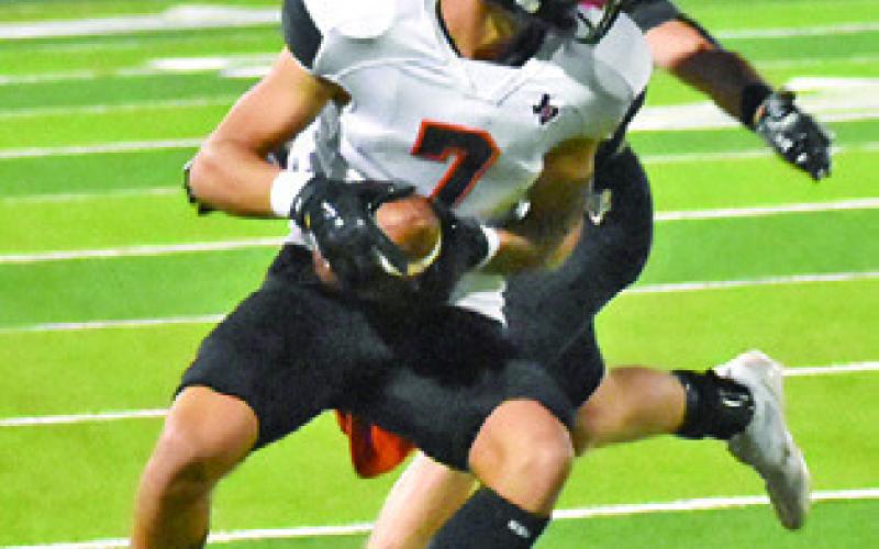 JAYDEN YOUNG makes a catch against Junction last Friday in Lago Vista. Tribune photo by Roy Sanders