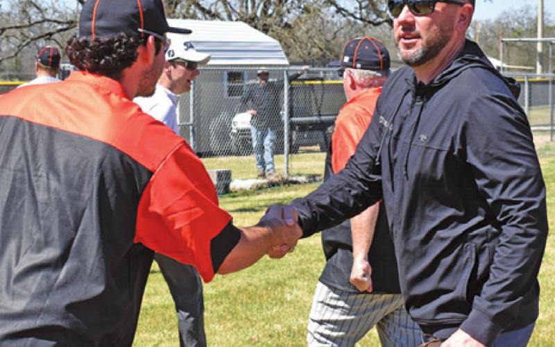 SOMERVILLE HEAD COACH Noah Leist greets Yegua alum Jeremy Fikac at the RTC game. -- Tribune photo by Roy Sanders