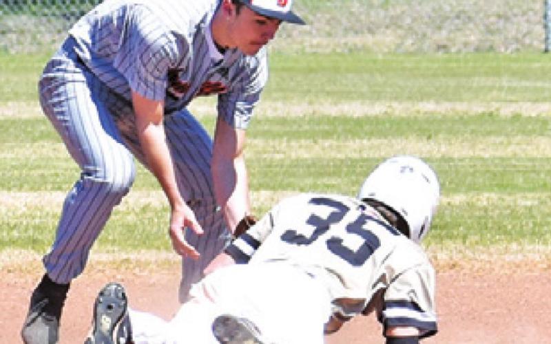 SOMERVILLE’S JOHNNY Legg tags out this Round Top-Carmine player at second base.