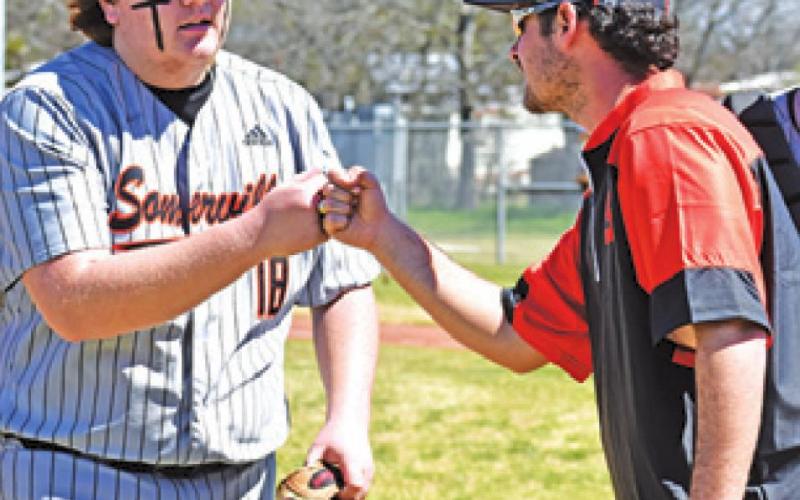 CULLEN SABLATURA is congratulated by Head Coach Noah Leist in the RTC game.