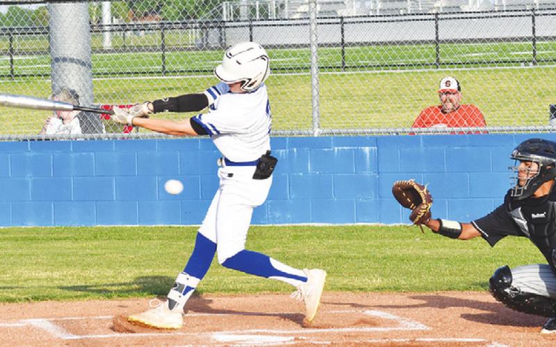 SNOOK’S CADEN SCHLUENS swings at the ball last Friday against Somerville in Snook.