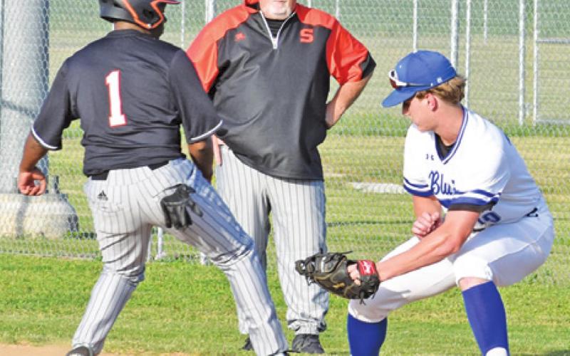 SOMERVILLE’S ARVIS BURNS tags the base as Snook’s Ryder Becka defends. Snook won 9-6 in the Friday game in Snook.