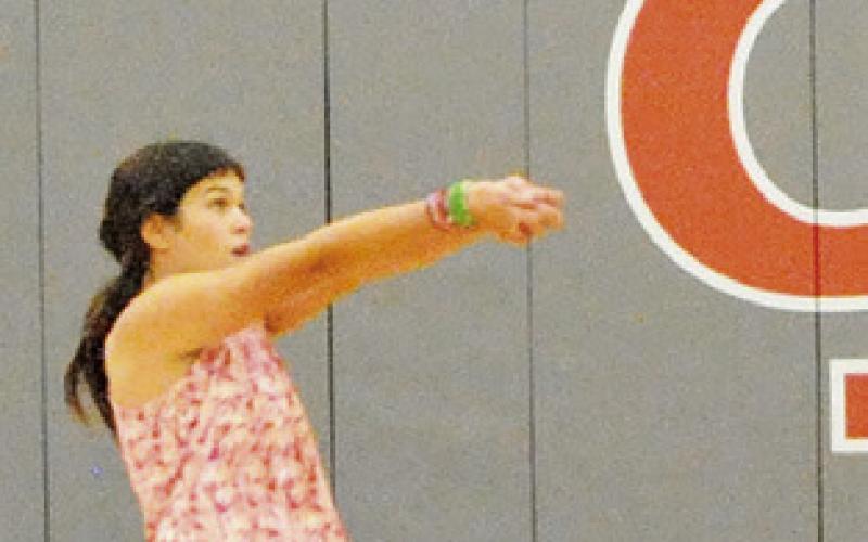 THIS CAMPER works on her bump during the annual Lady Hornet Volleyball Camp.