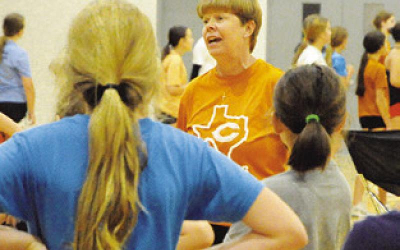 COACH WENDY WEISS talks to students attending the annual Lady Hornet Volleyball Camp. -- Tribune photo by Denise Squier