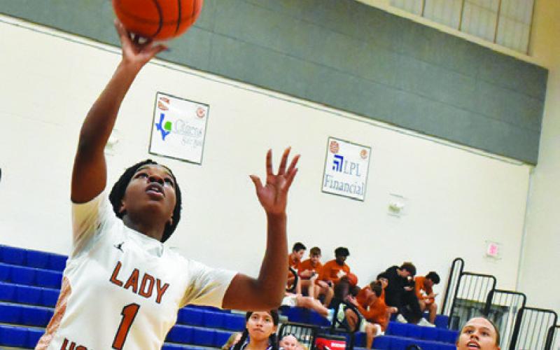 CALDWELL AMOREE DENSON attempts a layup during the Lady Hornets’ victory over Austin Achieve last Friday night at Hornet Gym.