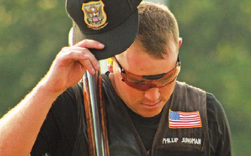 PHILLIP JUNGMAN tips his hat to the crowd during the Men’s Skeet competition at the National Shotgun Skeet Championship. -- Photo courtesy of USA Shooting