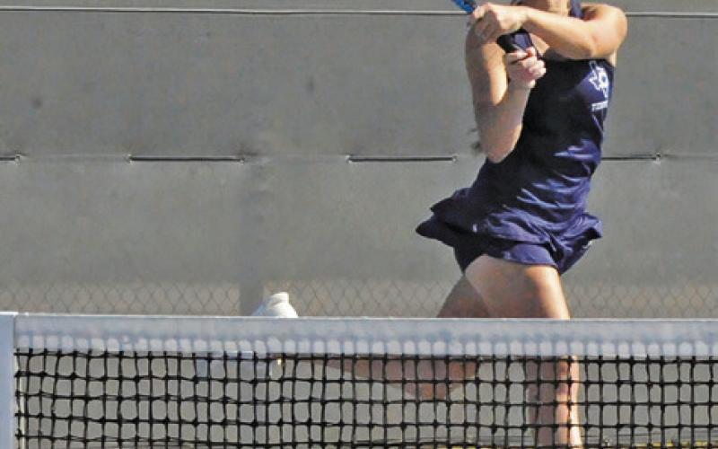 CALDWELL’S KYLIE VOGLER returns the ball during the Hornets’ team tennis regional semifinal match against Franklin last Thursday. Tribune photo by Denise Squier