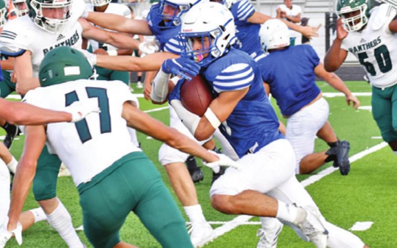 SNOOK’S JOSE GARCIA carries the ball against Normangee in last Friday’s scrimmage in Snook. -- Tribune photo by Roy Sanders