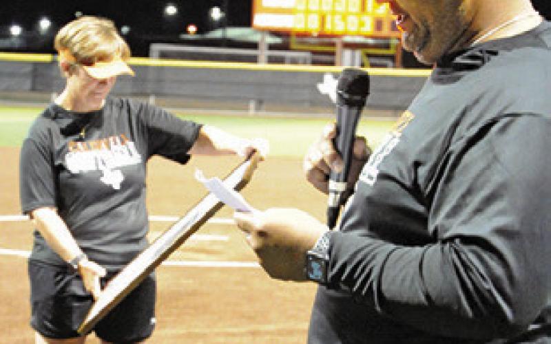 LONGTIME CALDWELL softball coach Wendy Weiss retired after the 2024 season -- which was a season when the Lady Hornets went undefeated in district play. She is pictured on “Wendy Weiss Day” with Marcus Escalante giving a speech, praising Weiss for her service to Caldwell.