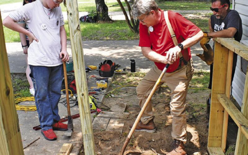 ANDY FISK, A U.M. Army adult leader digs this hole at this Somerville residence on Monday. -- Tribune photo by Roy Sanders