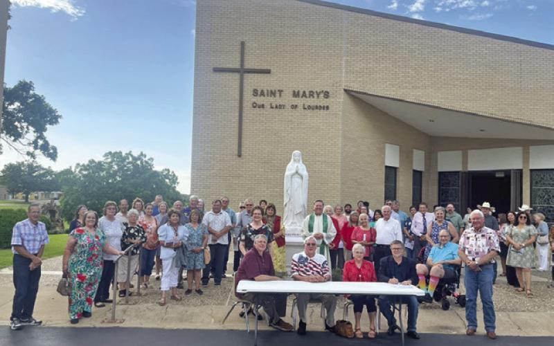 OFFICERS AND MEMBERS OF KJT Society #100, along with members of St. Mary’s Our Lady of Lourdes Catholic Church, celebrated Flag Day with the signing of a proclamation signed by Mayor John Rychlik. The KJT, Czech Catholic Union of Texas, encourages it’s members to recognize Flag Day each year in various ways. Society #100 appreciates the City of Caldwell and Mayor Rychlik for their cooperation with this project. Photo courtesy of Donna Rychlik