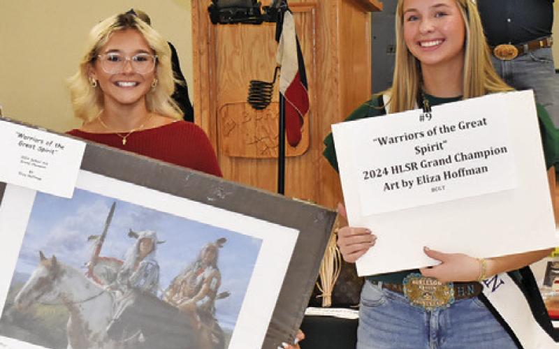 THESE AUCTION ITEMS are displayed by Bree Taylor and Hadleigh Novosad on Saturday at the Burleson County Go Texan Auction.