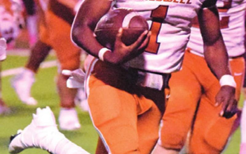 JAMAR HEWITT carries the ball for Caldwell. Hewitt gained 236 rushing yards.