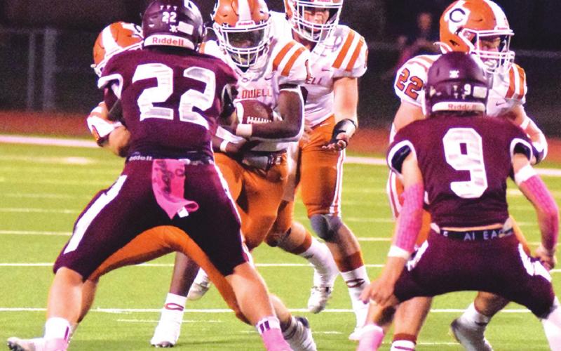 JAMAR HEWITT OF Caldwell carries the ball last Friday against Troy in Troy. -- Tribune photo by Denise Squier