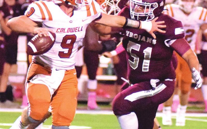 CALDWELL’S TRAVIS Balcar escapes this rush to pass. -- Tribune photo by Denise Squier