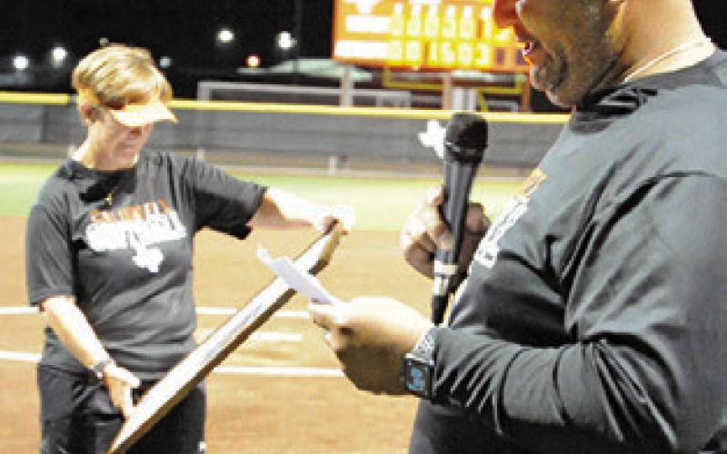 MARCUS ESCALANTE gives a speech honoring Wendy Weiss last Friday night. Weiss will be retiring at the end of this school year after coaching 29 years for the Lady Hornets.