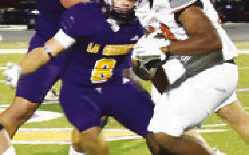 MICHAEL BUTLER carries the ball for Caldwell against La Grange.