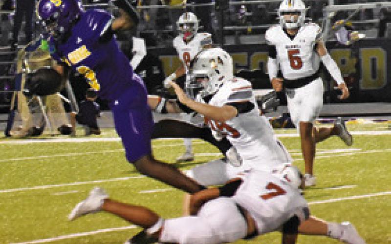 THE CALDWELL HORNETS defense tackles this La Grange ball carrier in last Friday’s game in La Grange.