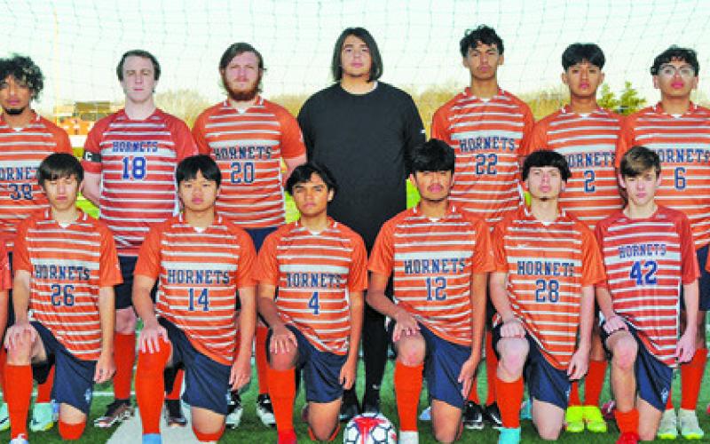 THE 2023 CALDWELL HIGH SCHOOL HORNET VARSITY SOCCER TEAM is, from left, front, David Lopez, Alex Reyes, Nam Le, Benjamin Jaimes, Quetzacoatl Bautista, Francisco Martinez, Mark LaSeur, David Goff, back, Coach Burt Yates, Steven Amaya, Barret Yates, James Coston, Nicholas Rutherford, Jeffrey Tobias, Daniel Morales, Jose Alvarez and Coach Wayland Jenkins. -- Photo courtesy of Dianne Pursch Photography
