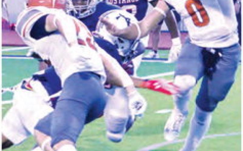 COY BECKA CARRIES the ball for Caldwell against Madisonville.