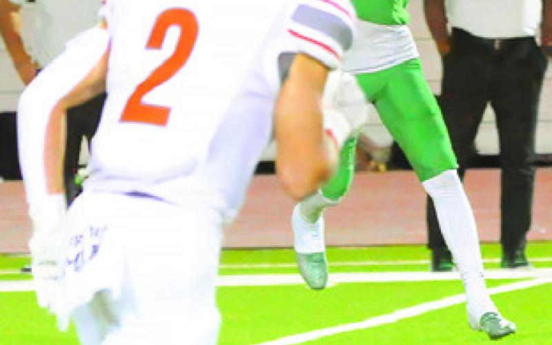 CALDWELL’S BLANE Garza moves in for a tackle as a Cuero receiver makes a catch.
