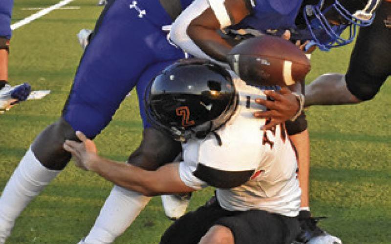 SOMERVILLE’S COLT Holton tackles Ke’Treen Carter of Snook as the ball comes lose. Somerville won the game 55-0. Tribune photo by Roy Sanders