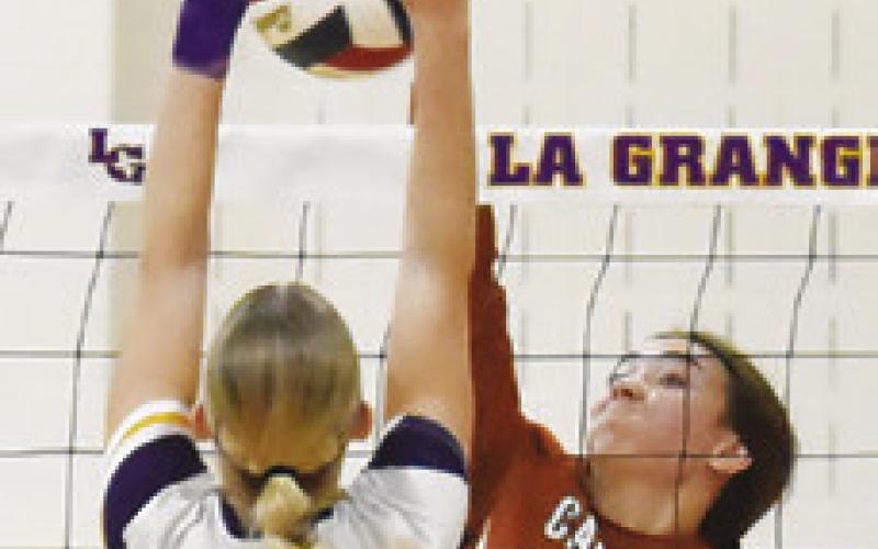 NATALIE EASTEPP tries to muscle the ball past La Grange’s Kylie Trlicek.