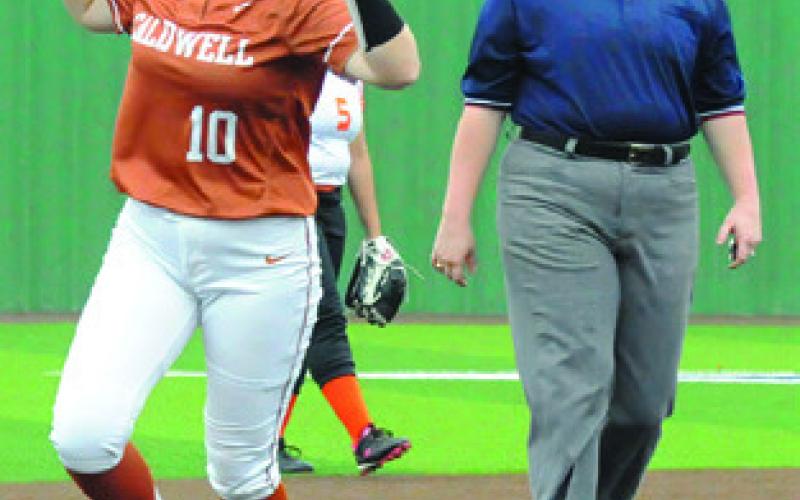 KELLY URBANOVSKY celebrates hitting a home run over the center field wall in the first inning. -- Tribune photo by Denise Squier