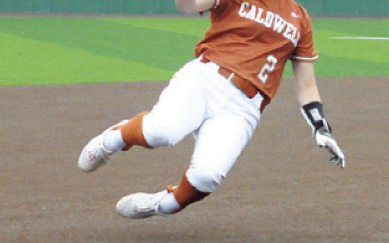KAMERYN HILL slides into third safely during the Caldwell-Houston Scarborough bi-district game last Thursday in Navasota.