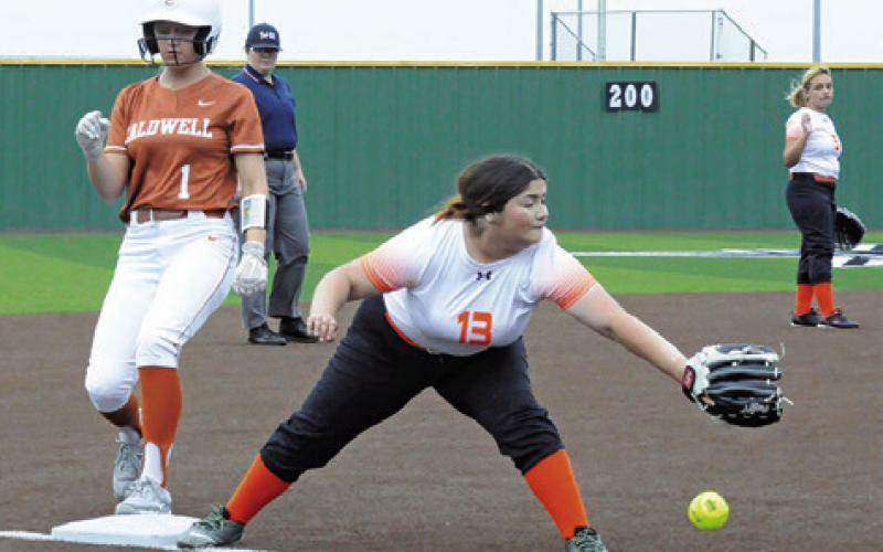 CALDWELL’S CAITLYN FAUST reaches third base during the Caldwell-HoustonScarborough bi-district game last Thursday.