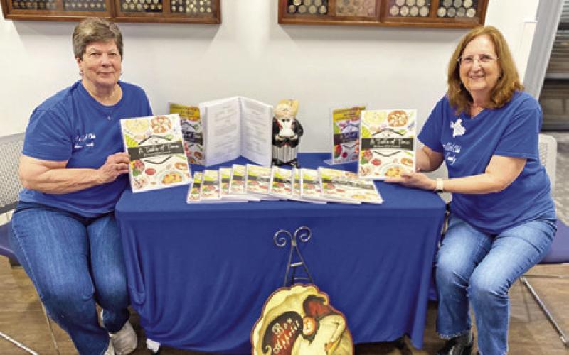 BRENDA KOLOJACO AND Debbie Schumacher pose for a photo for the Lyons Extension Education Association cookbook fundraiser. The cookbook sales will benefit the Lyons EEA Scholarship Fund. Photo courtesy of Lyons EEA