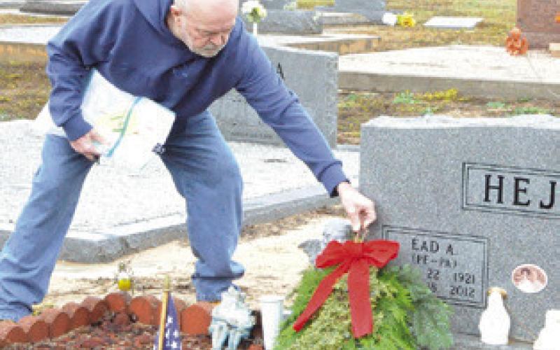 SWAGS AND WREATHS were placed on veterans’ grave in the Snook Cemetery as part of the Wreaths Across America campaign. The event was headed by the Snook Extension Education Association (EEA). Tribune photo by Denise Squier