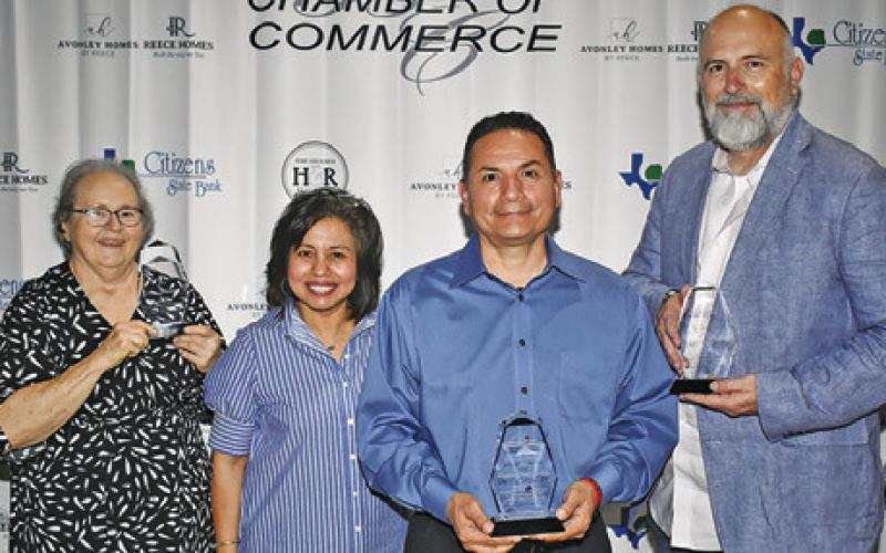 AWARD WINNERS GATHER after the chamber banquet. They included, from left, Ann Sebesta, Woman of the Year, Danny Segundo, Advocate of the Year, and Johnny Price Jr., Man of the Year. Joining them is Chamber Executive Director Susan Mott.