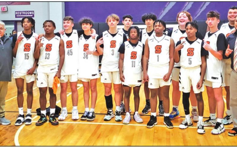 THE 2021-2022 SOMERVILLE YEGUA VARSITY boys basketball team is, from left, Coach Rene Cantu, Brandyn Carter, D.J. Bryant, Kason Rohrbach, Stevan Martinez, Johnny Legg, Gavin Williams, Herschel Conway, Gardner Shivers, Arvis Burns, Cullen Sablatura, Verkobe Woodberry, Kutter Rohrbach, Jesus Espinoza and Coach Josh Vela. Not pictured is Deven Green.