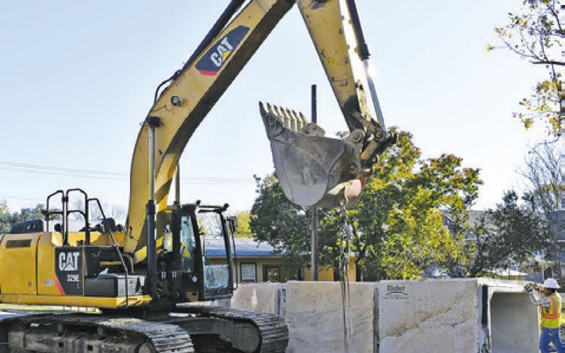 CONSTRUCTION CONTINUES ON Monday with the installation of these large box culverts on Harvey Street in Caldwell.