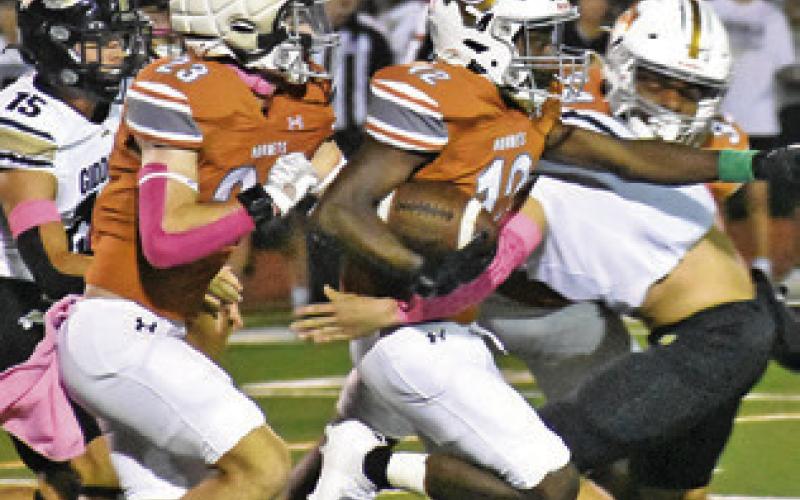 CALDWELL’S DEJUAN MATHIS carries the ball as teammate Braxton Fritcher follows in the Hornets’ 44-14 win over Giddings. Tribune photo by Roy Sanders