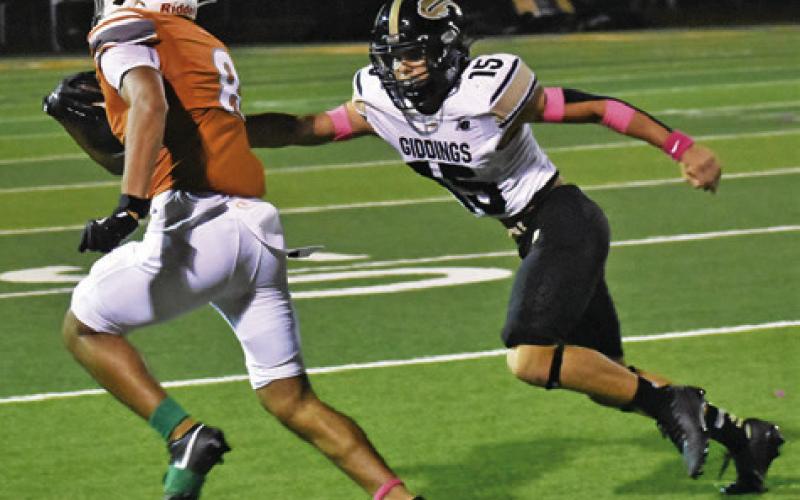 DYLAN CARTER OF Caldwell breaks free for a touchdown against Giddings. The Hornets won their district opener 44-14. Tribune photo by Roy Sanders