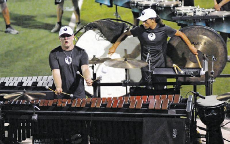 MEMBERS OF GENESIS’ pit crew had to cover multiple instruments during the corps’ performance Saturday in Caldwell.