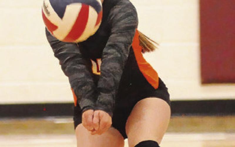 RHYAN RICCI bumps the ball during the Somerville-Hearne match last Friday. Tribune photo by Denise Squier