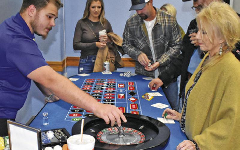 CASINO NIGHT PARTICIPANTS enjoy the games and festivities at the Rotary Club’s annual fundraiser event. Tribune photo by Roy Sanders