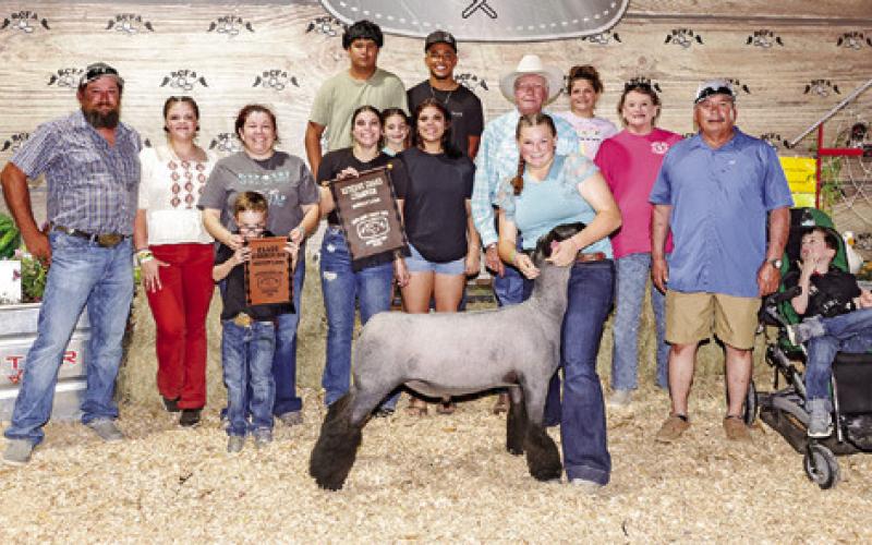CHEYENNE LEWIS EXHIBITED the Reserve Champion Lamb at the 2025 Burleson County Fair. Also pictured are Charles Lewis, Shanda Lewis, Emilie Leasure, Rylie Leasure, Grace Martin, Mackenzie Leasure, Larry Collier, Barbie Lewis, Frank Maldonado, Jackson Maldonado, Omar Carillo, X’Zavion Vela, Shelby Marin, Burleson County Fair Queen Kodi Hitchcock and Little Miss Taytum Hohlt.