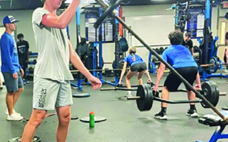 FUTURE BLUEJAYS, pictured left top and bottom, enjoyed learning skills at basketball and football camps last week. Current Bluejays and Lady Jays were on hand in the weight room working out during Strenght &amp;amp; Conditioning Camp (above).