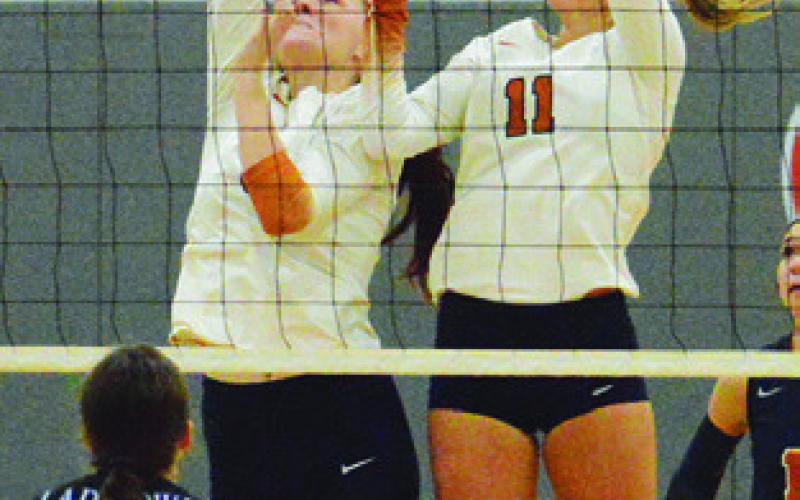 KAELY BROWN AND Reese McManus reach for the ball during the Lady Hornets’ win over Anderson-Shiro at home on Friday. Tribune photo by Kimberly Hutcheson