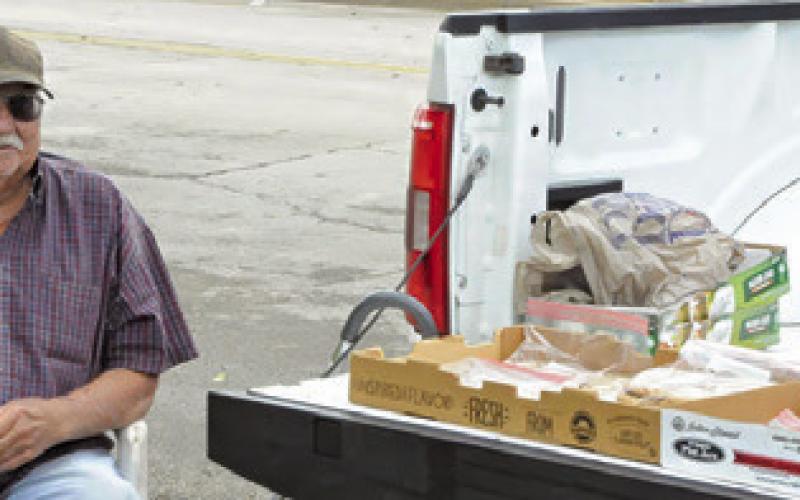 AREA FARMERS HAD vegetables and canned goods for sale at the Burleson County Farmers Market Saturday morning. Tribune photo by Denise Squier