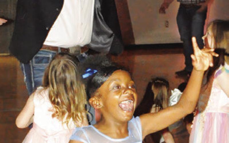 DADDY’S AND THEIR little princesses enjoyed Friday night’s “Daddy Daughter Dance” in the Snook Elementary School. Tribune photo by Denise Squier